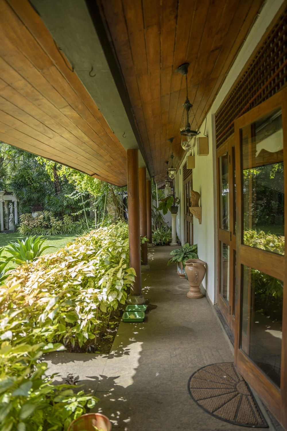 A garden next to an open verandah